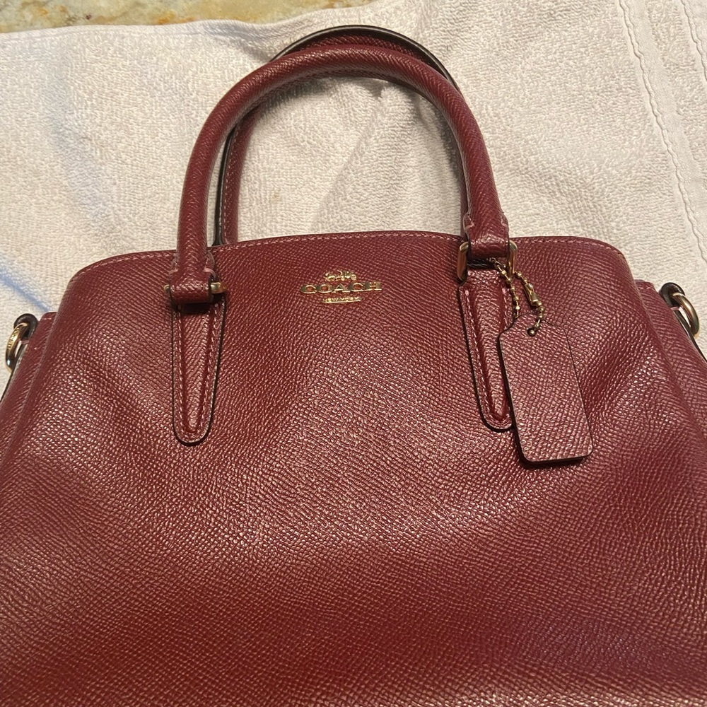 Beautiful burgundy Coach handbag.